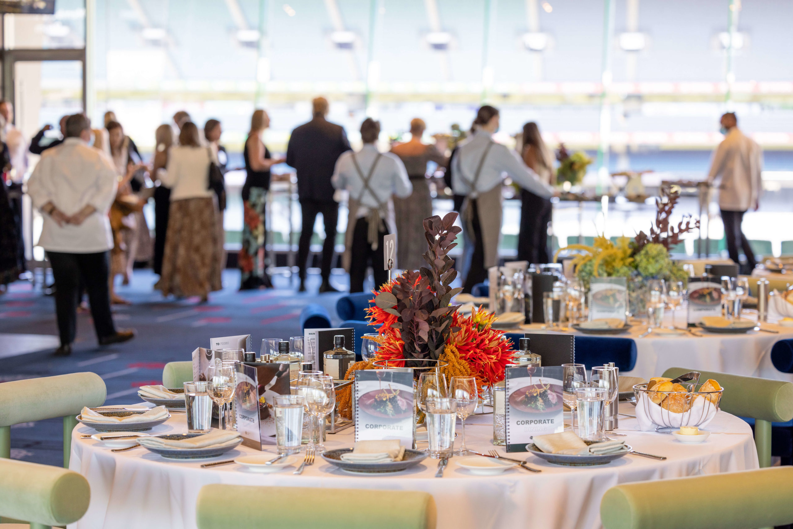overview of table settings and attendees taking in stadium